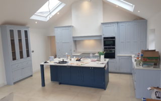 hand-painted-kitchen-2 pale blue bespoke handpainted kitchen with large island and velux skylights