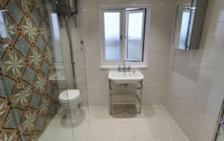 bathroom in loft conversion with feature wall tiles Walk in shower room in luxury bathroom in home extension