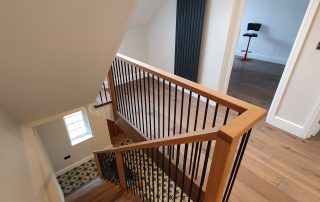 Finished contemporary wooden stairs in strawberry hill family home extension