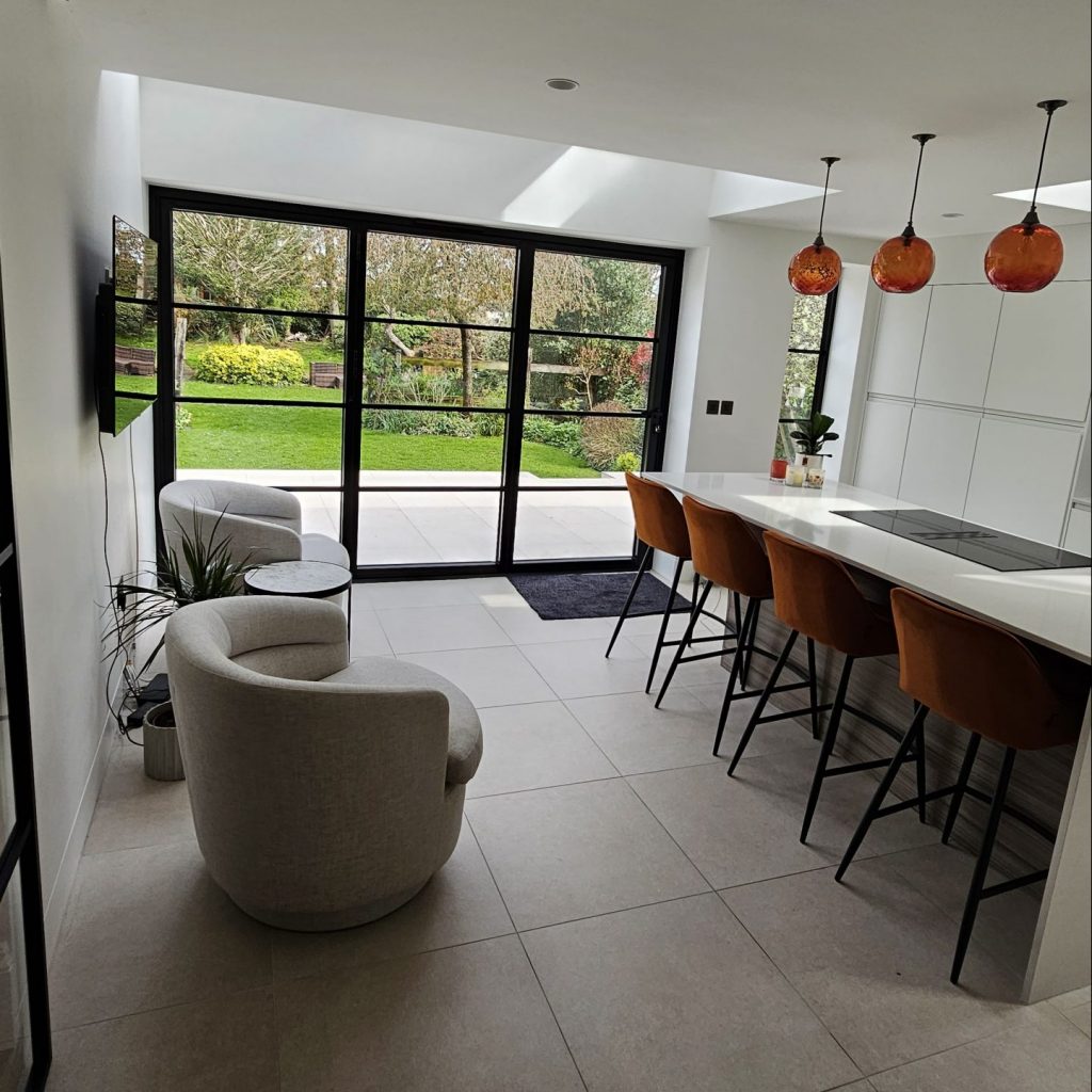 Lebanon park new kitchen island in twickenham completed new kitchen with build in induction hob in the island and 4 bar stools