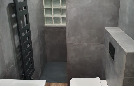 matt black heated towel rail by walk in shower