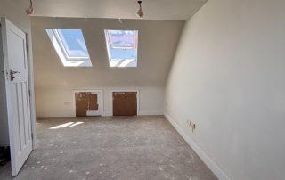 loft master bedroom with velux roof windows