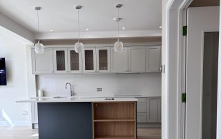 kitchen crop in wellesley crescent Open Plan Kitchen with pendant lighing over island