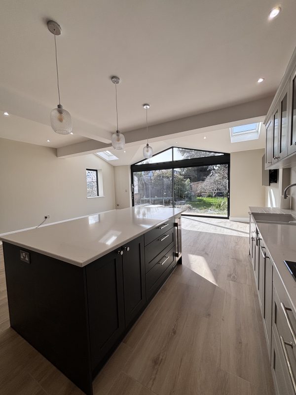 Wellesley Crescent kitchen and family room Kitchen view out to garden with glass pendant lighing